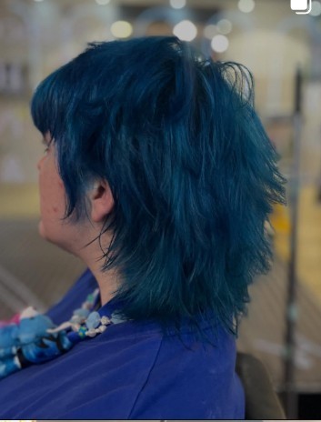 Electric blue mullet, short on top with a long tapered tail