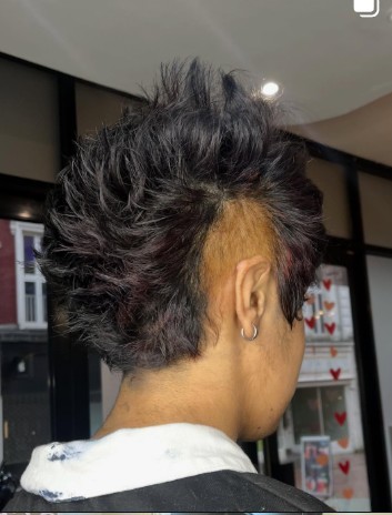Dark brunette mullet with a textured top