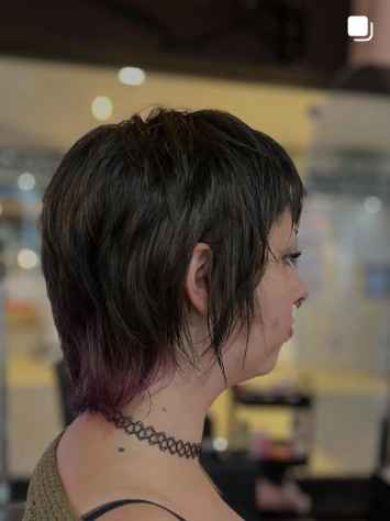 Dark emo messy cut with a heavy curtained fringe over the eyes