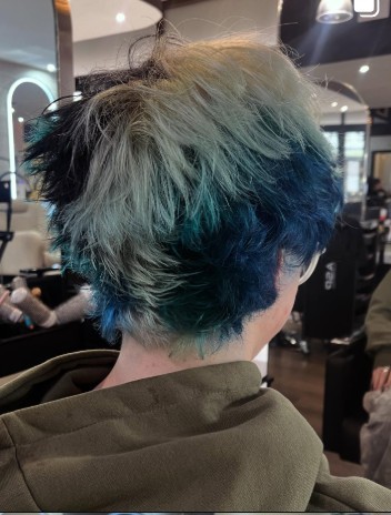 Teal green mullet, layered and razored at the back